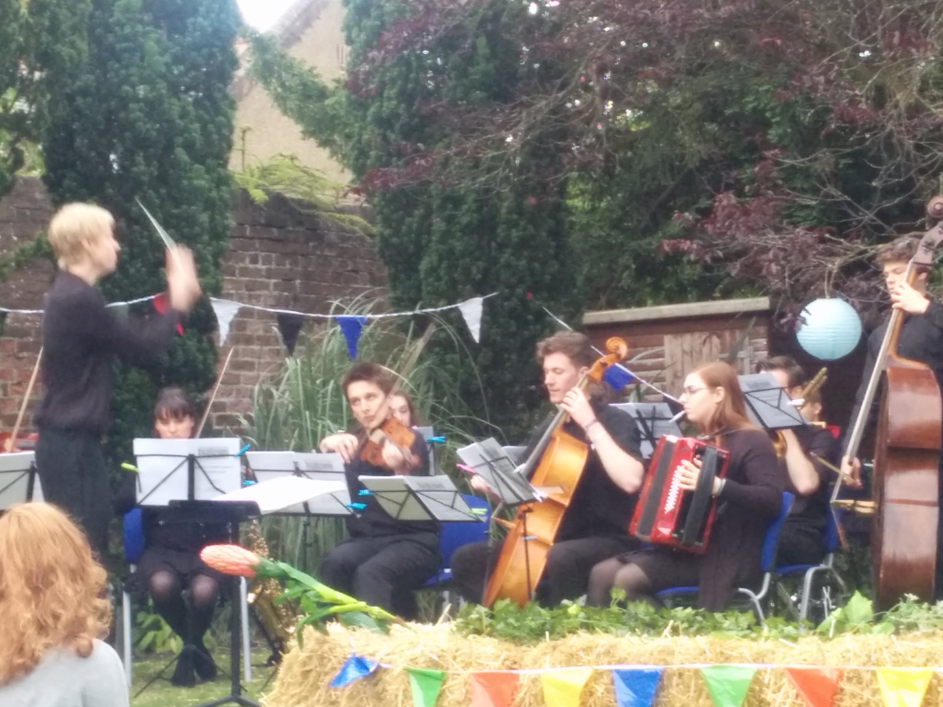 musical director Josh Ridley conducting the band for DOE Alice